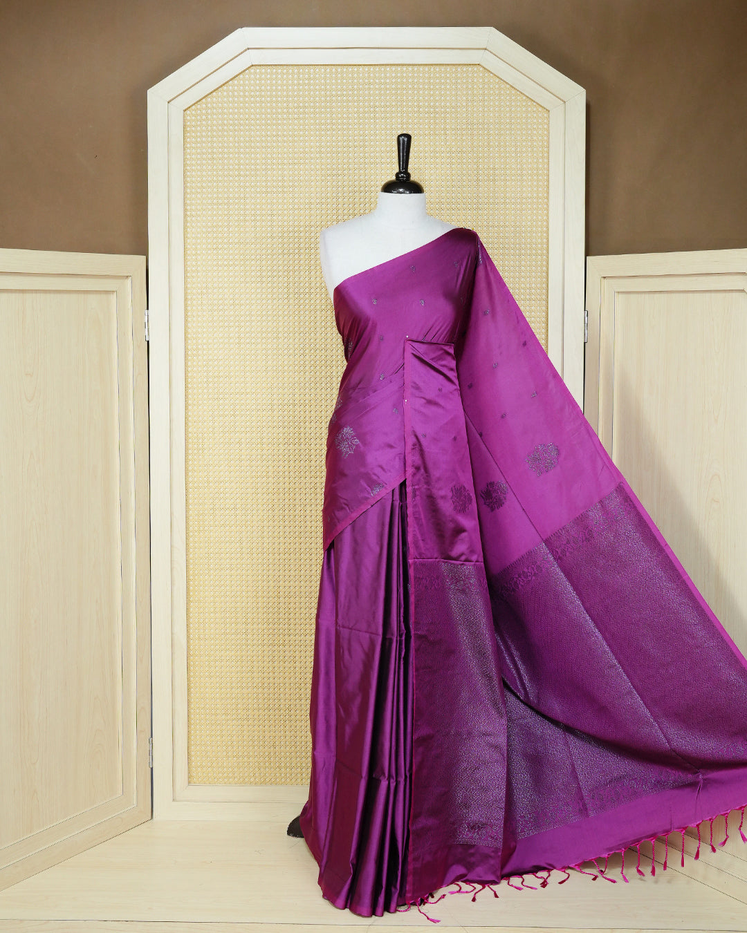 Dark magenta colour soft silk saree featuring antique zari motifs on body with contrast self colour pallu & paired with matching blouse piece.