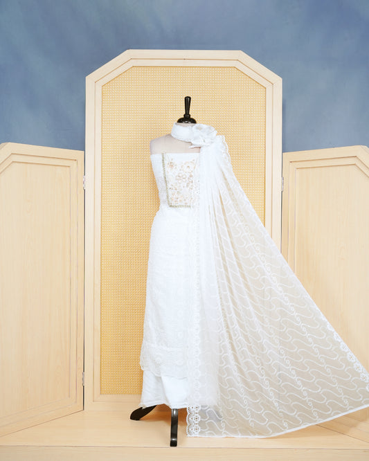 White Georgette Salwar Matierial Features an Intericat Floral Bead Work Pattern Aborned With Shimmering Sequins and Pearl Lace Border Work, Pired with matching bottom & elegant Duptta