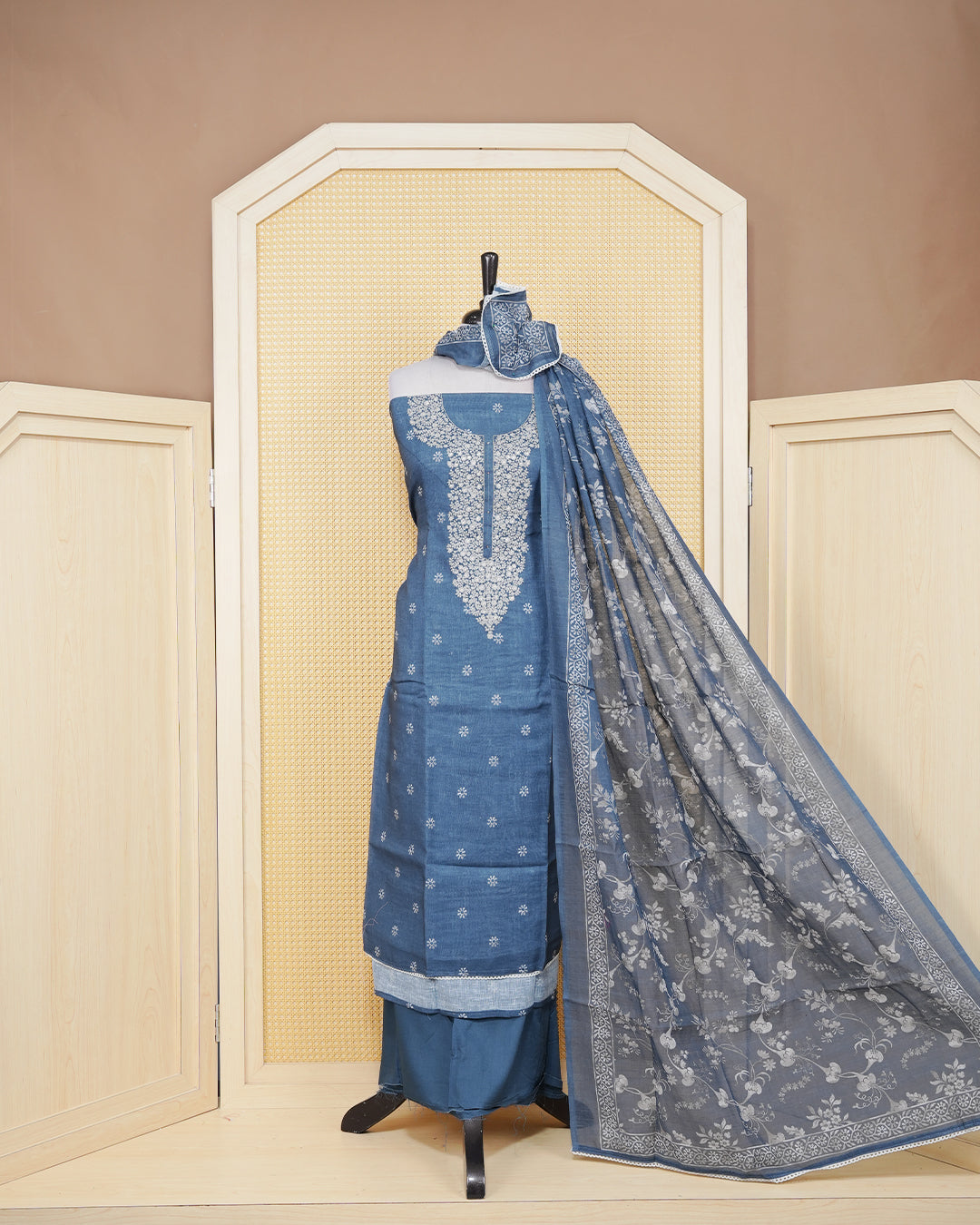 Dusty Blue colour Net kota salwar material featuring elegant Threadwork on neck portion & floral prints on body, paired with a matching bottom and an elegant dupatta.