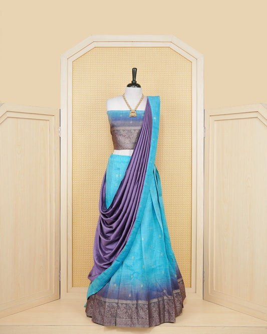 Sky blue & lavender colour Linen Silk Semi stitched dhavani set featuring buttas, zari bordered skirt & blouse piece and dupatta.