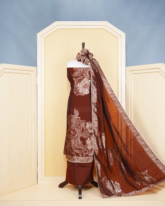Maroon Silk Salwar Matierial Featuers an Anstract Wavy Line Embroidary Pattern Aborned With Shimmering Metalic Gold Thread, pired with matching bottom & elegant Duptta