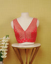 Red colour Sleeveless Blouse Featuring A Stylish V-Neck, Elegant Woven Pattern With Gold Butta Motifs, And A Comfortable Tailored Fit.