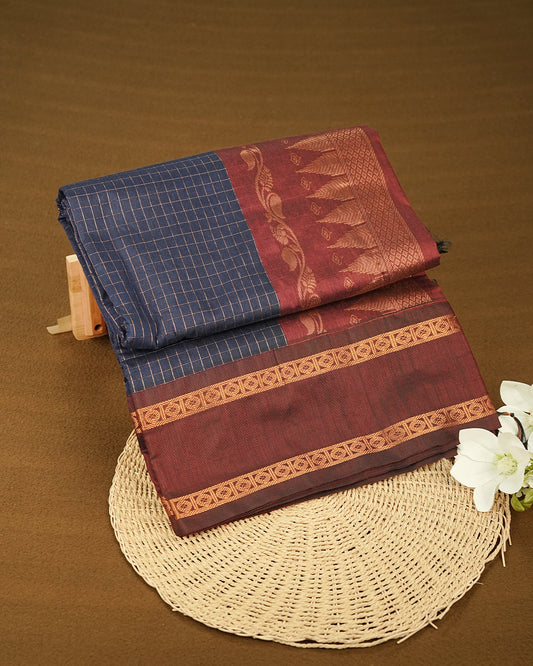 Navy Blue colour kalyani cotton saree featuring Copper zari check pattern on body, complemented by Maroon colour with Antique zari border, paired with matching blouse piece