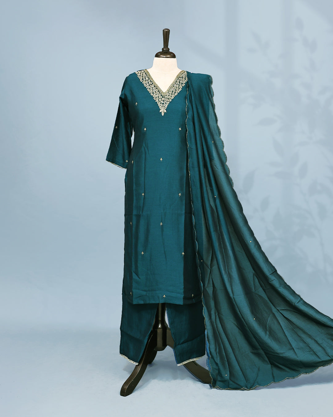Green colour Salwar set comes top with Stone & beats on neck line and buttas in body, paired with matching bottom and dupatta.
