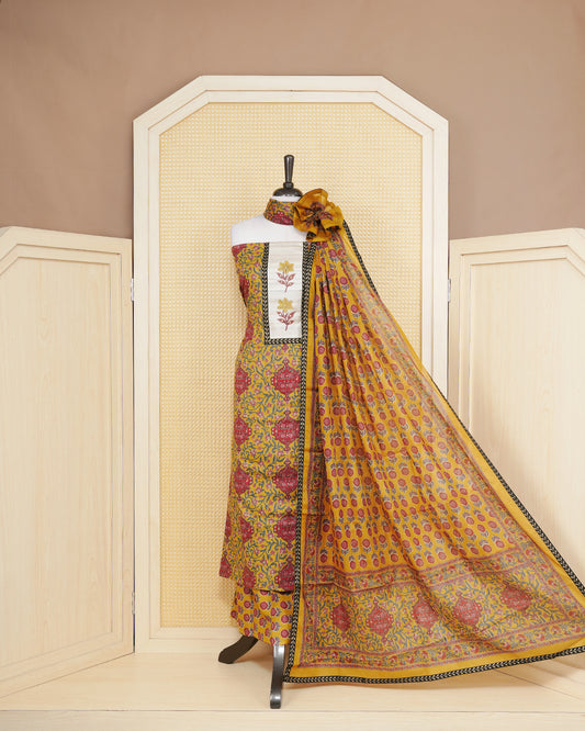 Dark yellow colour salwar material featuring Floral print and mirror work with elegant border, paired with matching bottom and an elegant dupatta.