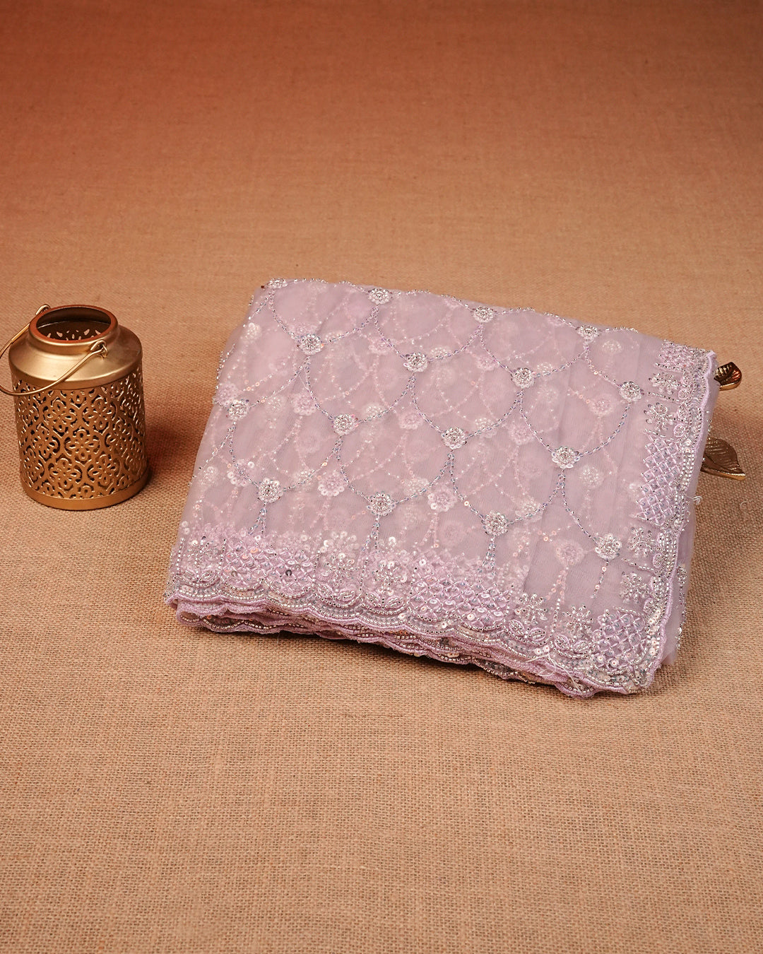 Lavender colour Net Designer saree featuring Beats & Sequins geometric Pattern on body & worked border, comes with matching blouse piece.