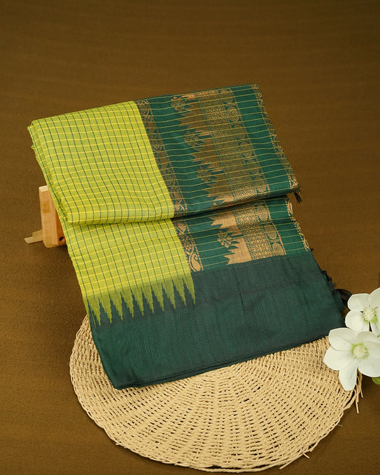 Green colour kalyani cotton saree featuring  check pattern on body, complemented by Dark Green colour with Antique zari border, paired with matching blouse piece