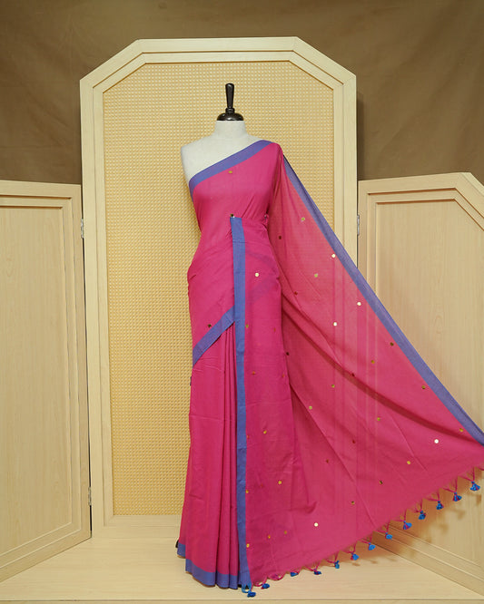 Magenta colour Mul cotton saree featuring Gold Sequins, complemented by Contrast Blue simple Border & tassels.