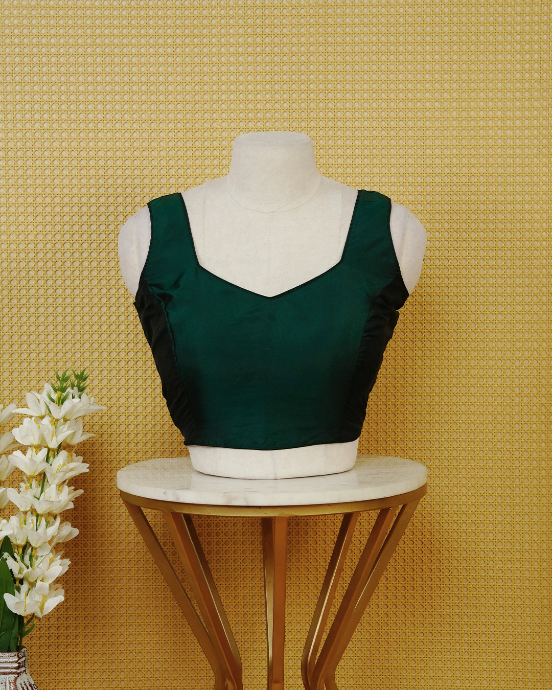Green colour Sleeveless Blouse Featuring A Stylish Sweetheart Neck, Smooth Finish, And A Comfortable Tailored Fit.