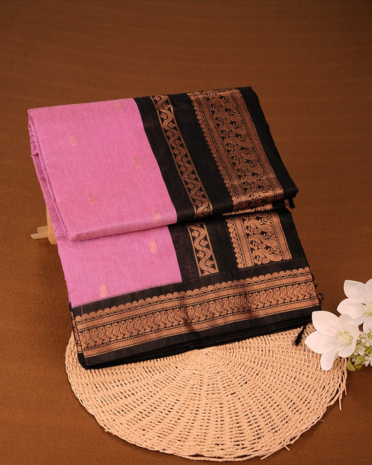 Pink Colour Kalyani Cotton Saree Featuring Gold Zari Patterns on the Body, Complemented by a Black Colour with Gold Zari Border , Paired with a Matching Blouse Piece.