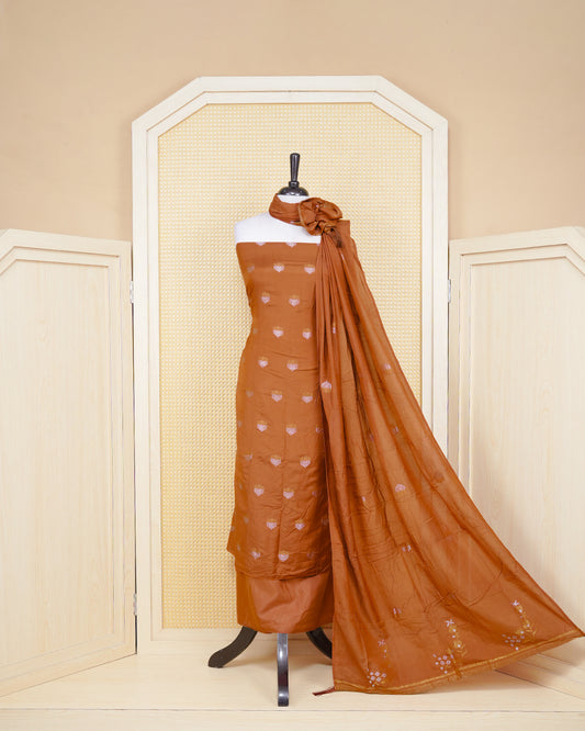 Burnt Orange Colour Banaras Salwar Material Featuring Floral Thread Pattern on Body, Paired with Matching Bottom & Elegant Dupatta