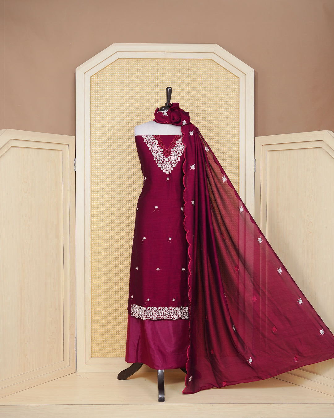 Maroon colour Georgette Salwar material featuring an Floral Threadwork on Body, paired with a matching bottom and an elegant dupatta.