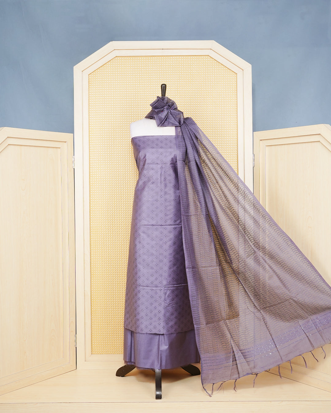 Deep Purple Woven Jacquard Salwar Material Featurs a Subtle Self-Textered Patten Aborned With Shimmering Embossed Geomatric Cross Motifs With Matching Bottom & Elegant Dupatta