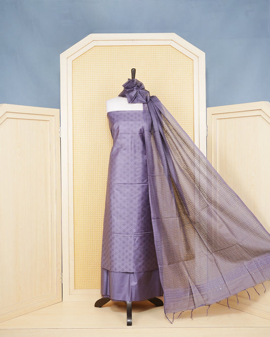 Deep Purple Woven Jacquard Salwar Material Featurs a Subtle Self-Textered Patten Aborned With Shimmering Embossed Geomatric Cross Motifs With Matching Bottom & Elegant Dupatta