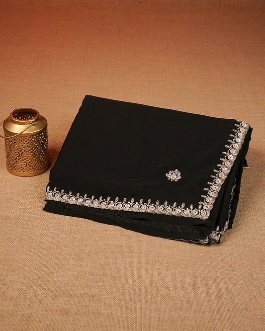 Black colour Chiffon Designer saree featuring Beats & Sequins Motifs on body and worked border, comes with matching blouse piece.