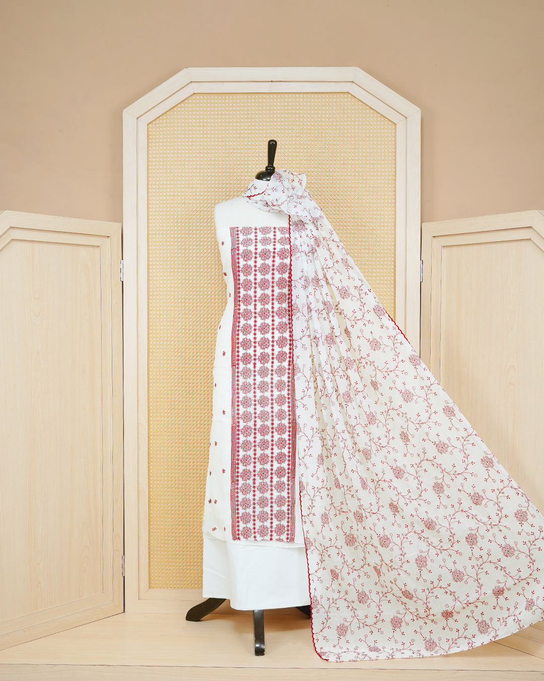 White colour Georgette Salwar material Featuring Gold zari floral motifs on body, paired with matching bottom & Elegant Dupatta