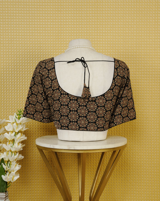 Black Colour Blouse Featuring A Classic U-Neck, Intricate Floral Geometric Print, And Comfortable Elbow Length Sleeves.