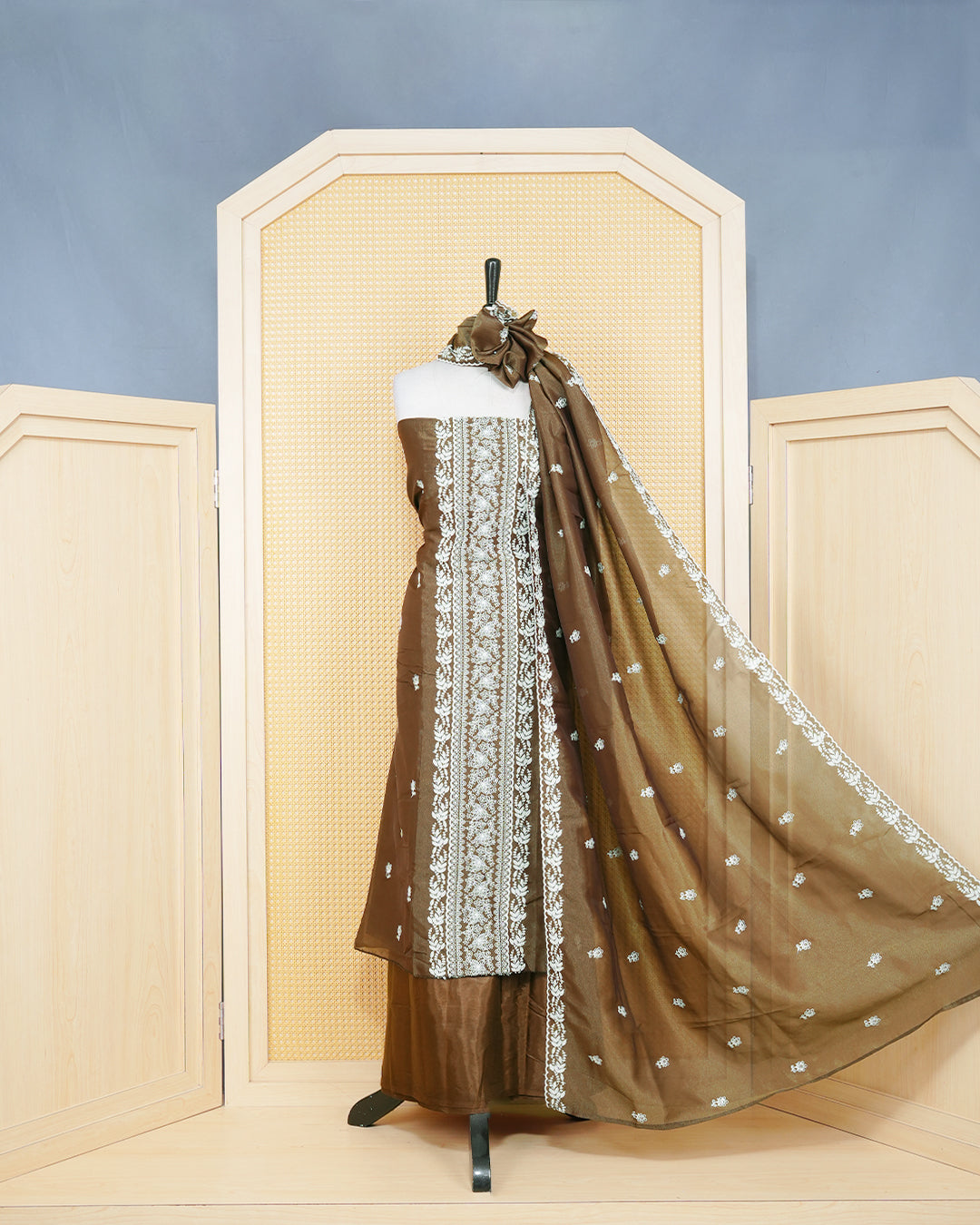 Brown Georgette Salwar Material Features an Inrcate Floral Emproidary Pattern Aborned With Shimmering Sequin Accents, paired with matching bottom & elegant Duptta
