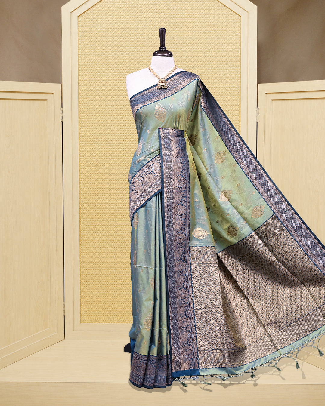 Olive green & gold double shade Mulberry silk saree featuring floral gold zari patterns on body, paired with contrast teal colour with traditional border, comes with matching blouse piece.