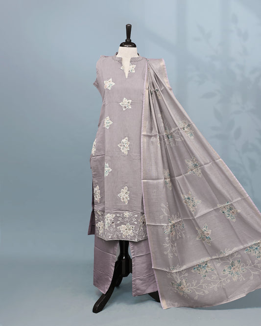 Lavender colour Salwar set comes top with floral pattern on body, paired with matching bottom and dupatta.