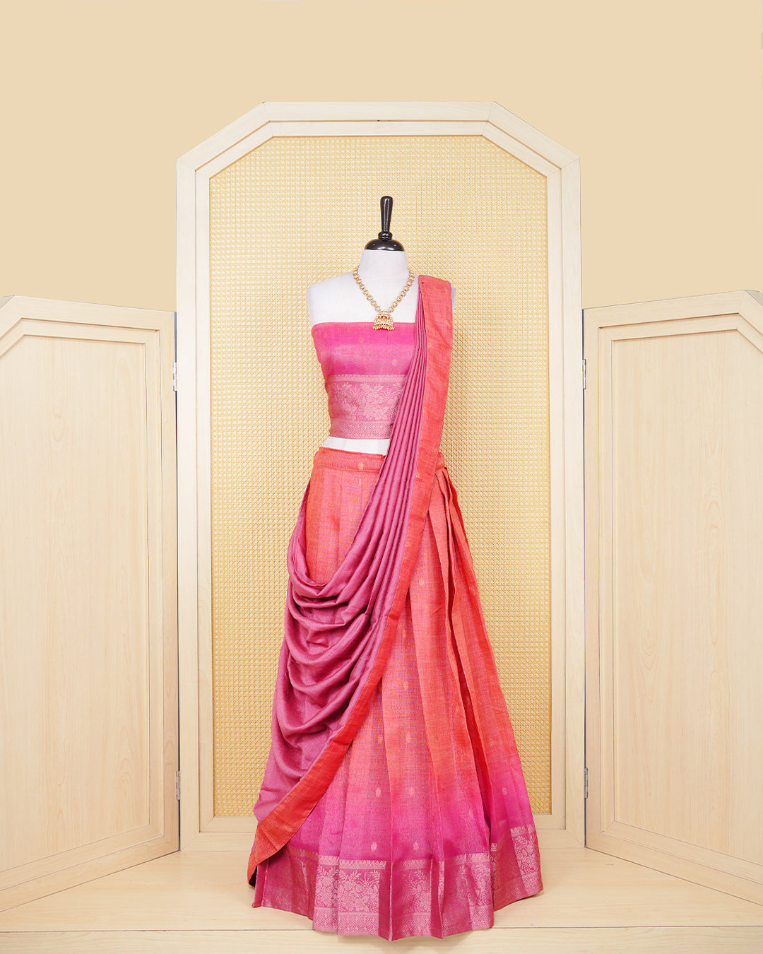 Burnt orange & magenta pink colour Linen Silk Semi stitched dhavani set featuring buttas, zari bordered skirt & blouse piece and dupatta.