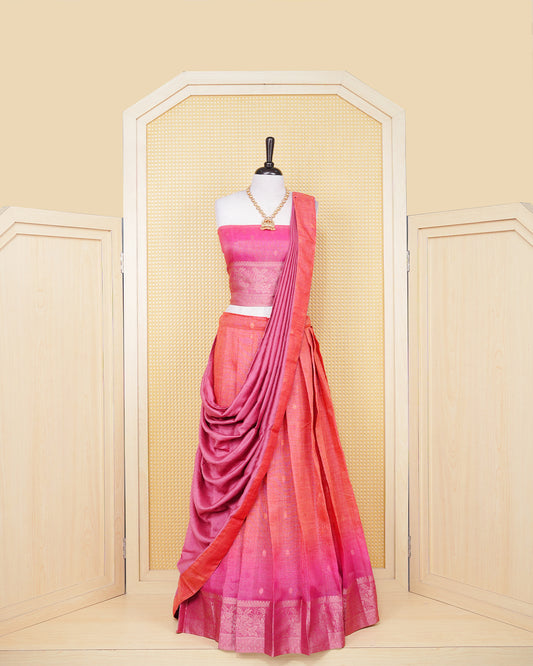 Burnt orange & magenta pink colour Linen Silk Semi stitched dhavani set featuring buttas, zari bordered skirt & blouse piece and dupatta.