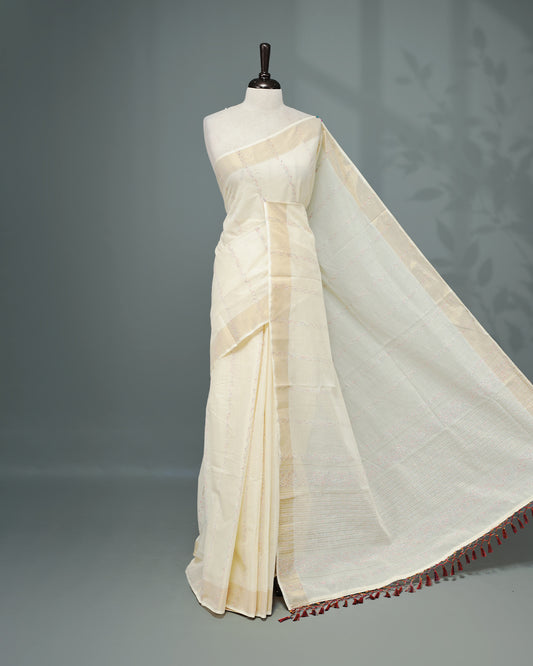 Cream colour Cotton kerala saree featuring Multicolour & gold Strips on body, complemented by Gold zari Border, paired with matching blouse piece.