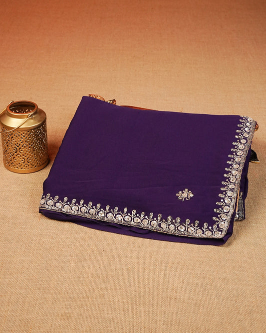 Purple colour Chiffon Designer saree featuring Beats & Sequins Motifs on body and worked border, comes with matching blouse piece.