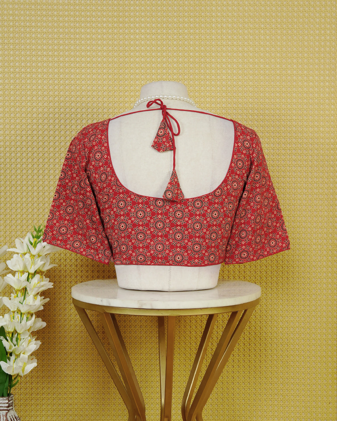 Red Colour Blouse Featuring A Classic U-Neck, Intricate Floral Geometric Print, And Comfortable Elbow Length Sleeves.