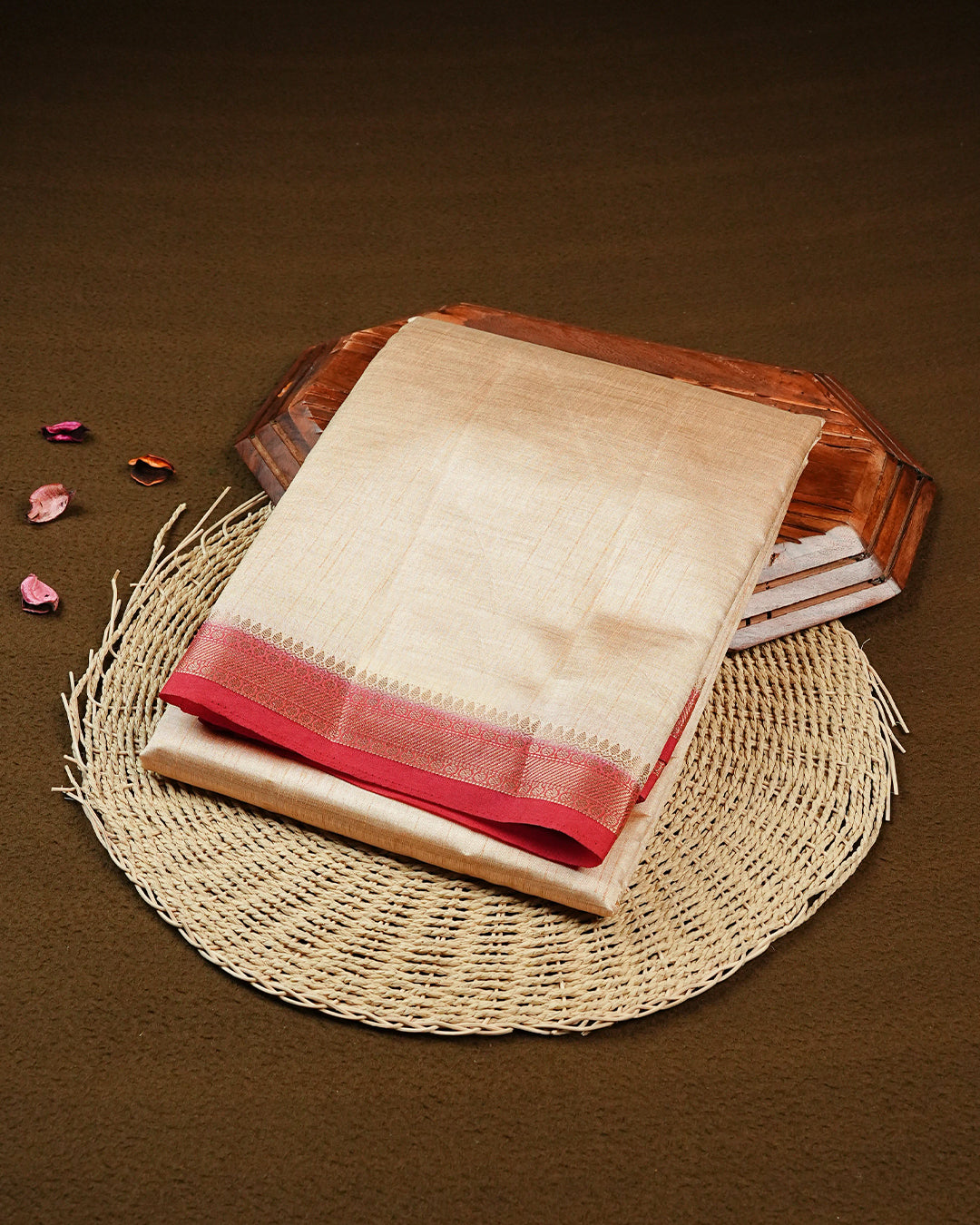 Cream colour Tussar silk saree Featuring Elegant Plain body, complemented by Contrast Red colour with gold zari border, paired with matching blouse piece.