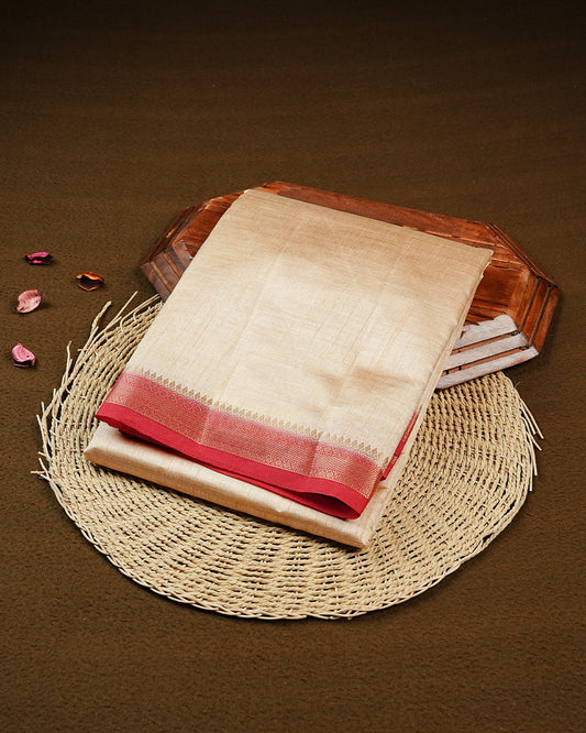 Cream colour Tussar silk saree Featuring Elegant Plain body, complemented by Contrast Red colour with gold zari border, paired with matching blouse piece.