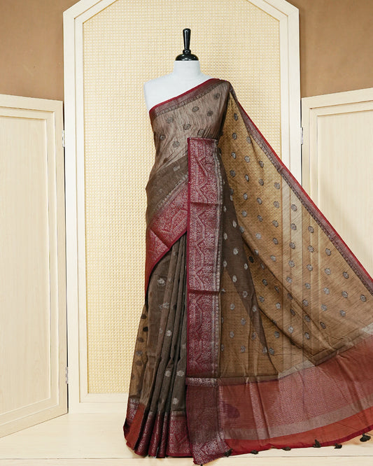 Light chocolate colour semi linen saree thread motifs on body, contrast light red colour gold zari border, rich pallu comes with matching blouse piece