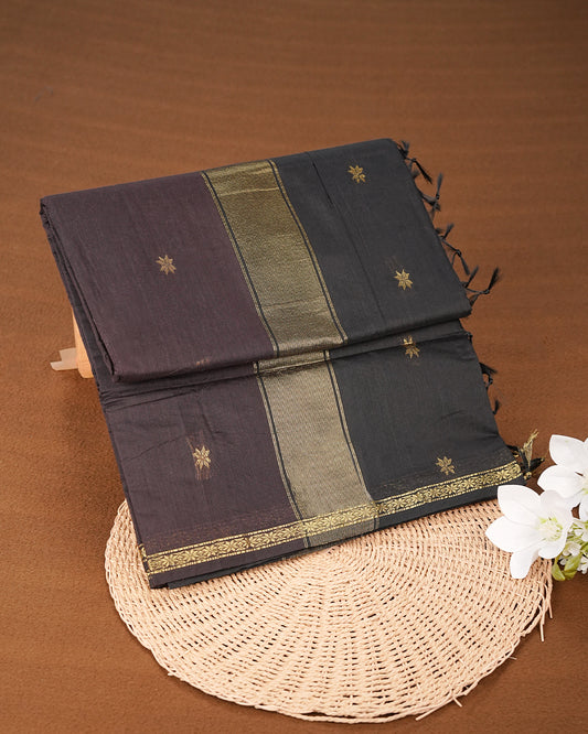 Dark Brown colour kalyani cotton saree featuring gold zari Floral pattern on body, complemented by Black colour with Stripes & Floral Gold zari border, paired with matching blouse piece