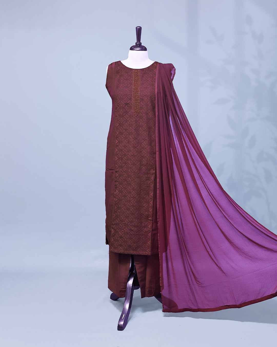 Wine colour Salwar set comes top with thread work on body, paired with matching bottom and dupatta.