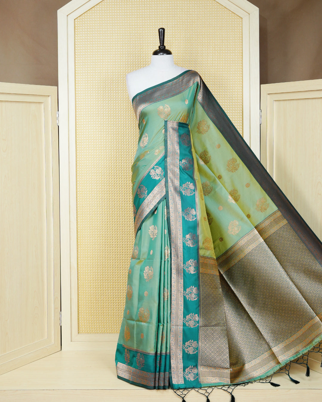 Olive green & gold double shade Mulberry silk saree featuring floral gold zari patterns on body, paired with contrast teal colour with traditional border, comes with matching blouse piece.