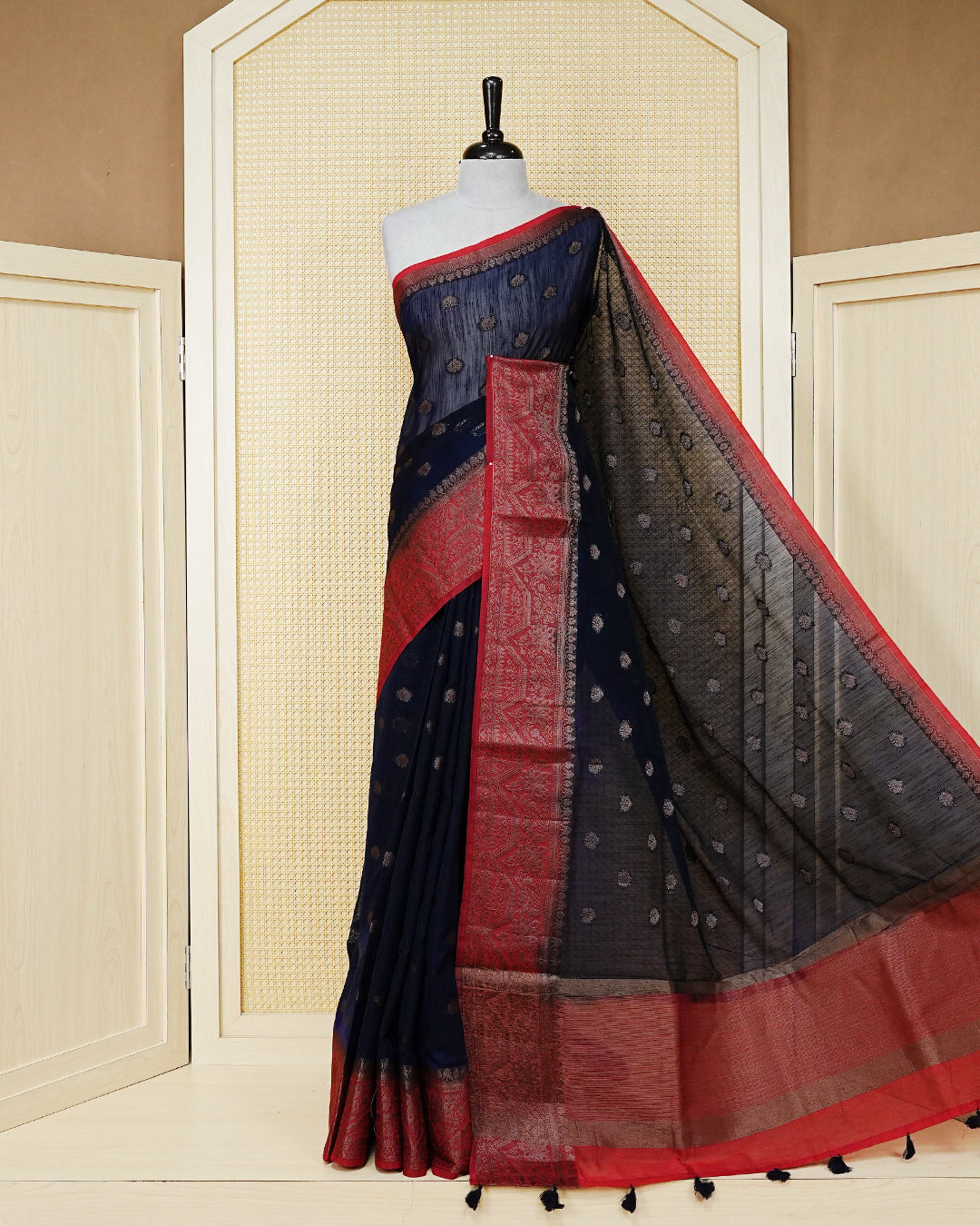 Navy blue colour semi linen saree thread motifs on body, contrast red colour gold zari border, rich pallu comes with matching blouse piece