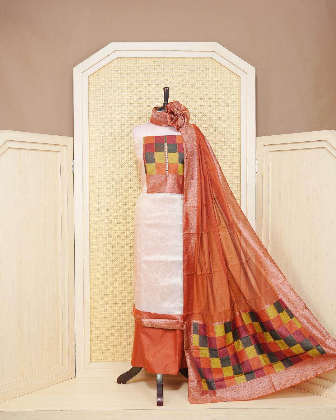 Cream colour Tissue Salwar Material Featuring  Plain Body, multi colour check pattern on chest portion, Paired With a Matching Bottom and an Elegant Dupatta.