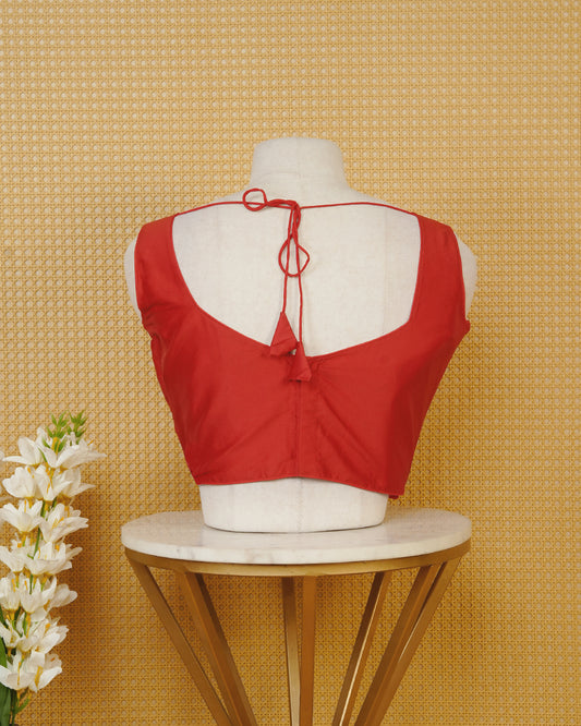 Red colour Sleeveless Blouse Featuring A Stylish Sweetheart Neck, Smooth Finish, And A Comfortable Tailored Fit.