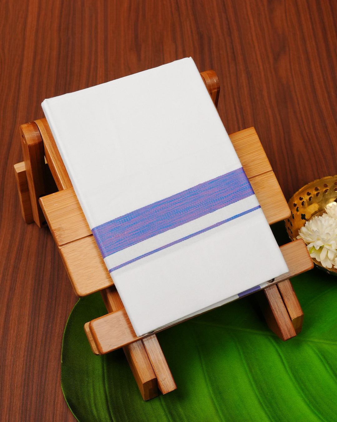 White colour cotton single dhoti featuring pink & Blue border.