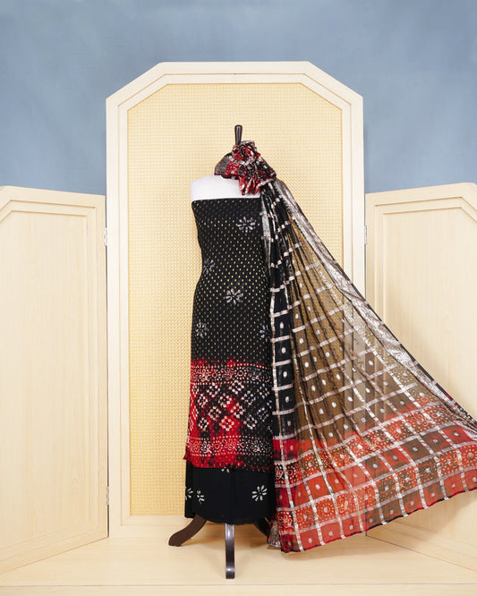Black & Red Shade Georgette Salwar material Features a Vibrent Tie Dye Pattern Aborned With Shimmering Metallic Gold foil Dots,pired with matching bottom & elegant Duptta