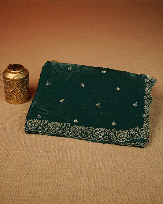 Green colour Velvet chiffon designer saree featuring delicate stone motifs on body and stone worked border, comes with matching blouse piece.