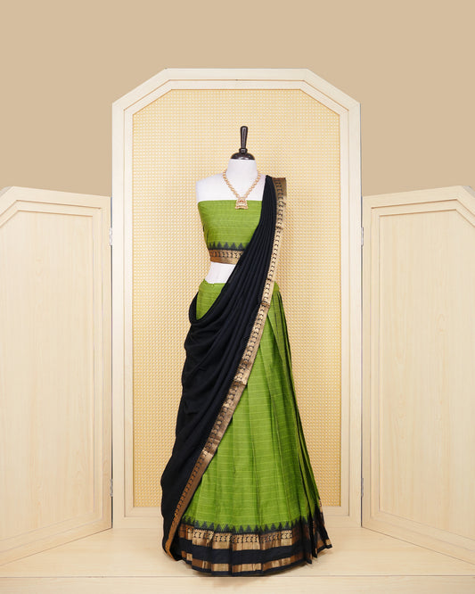 Leaf green colour Chettinad Semi Stitched dhavani set Featuring black with Gold zari on skirt, matching Blouse & Contrast dupatta.