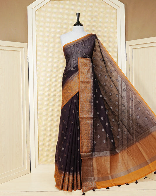 Dark brown colour semi linen saree thread motifs on body, contrast orange colour gold zari border, rich pallu comes with matching blouse piece