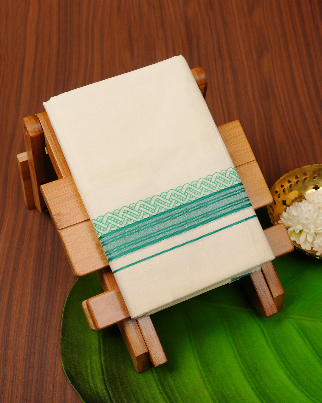 Cream colour cotton Double dhoti featuring Green border with print.