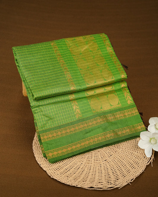 Green colour kalyani cotton saree featuring zari check pattern on body, complemented by Contrast colour with Antique zari border, paired with matching blouse piece