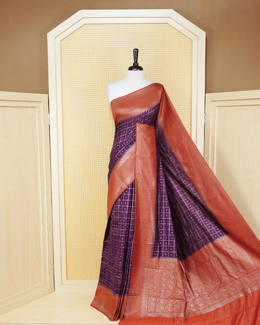 Grape Colour Semi georgette Saree having zari check with buttas pattern on body, contrast rust orange colour floral designed border, Rich Pallu comes with Matching Blouse piece.