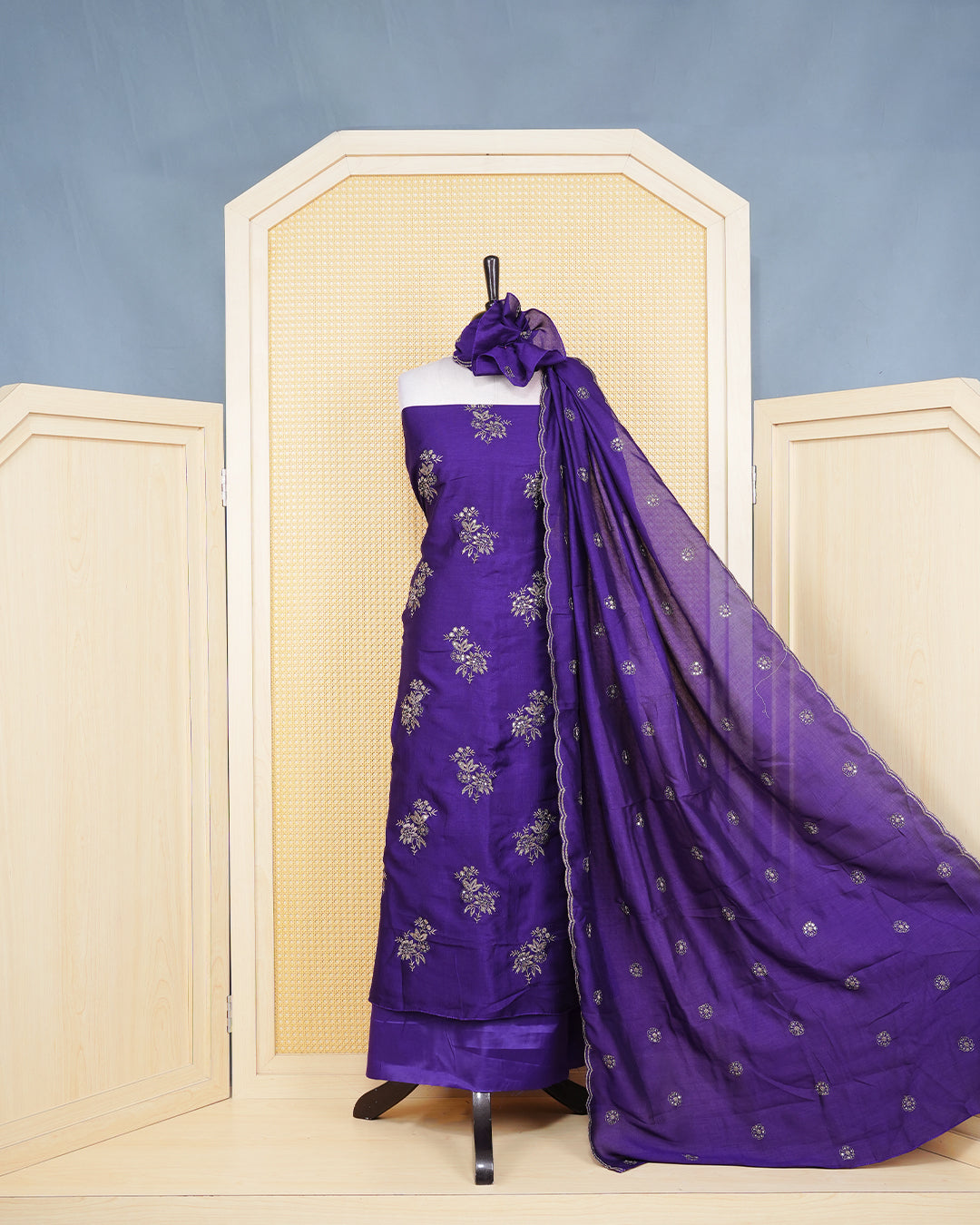 Royal Violet Georgette Salwar Matierial Features an Elegant Floral Embroidery Pattern Aborned With Shimmering Metalic Gold Thread and Sequin Accents, pired with matching bottom & elegant Duptta