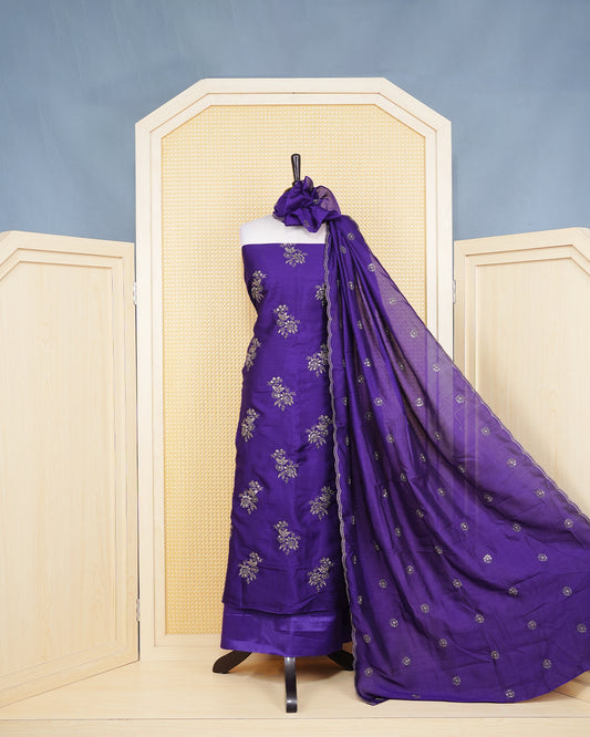 Royal Violet Georgette Salwar Matierial Features an Elegant Floral Embroidery Pattern Aborned With Shimmering Metalic Gold Thread and Sequin Accents, pired with matching bottom & elegant Duptta