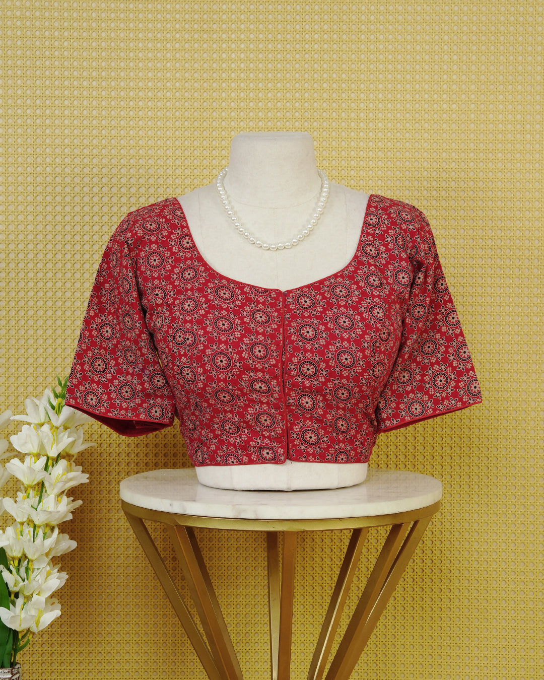 Brick Red Colour Blouse Featuring A Classic U-Neck, Intricate Floral Geometric Print, And Comfortable Elbow Length Sleeves.