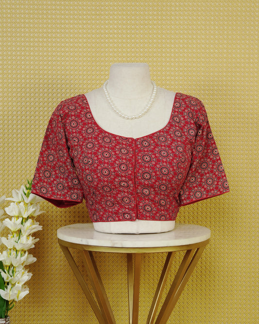 Brick Red Colour Blouse Featuring A Classic U-Neck, Intricate Floral Geometric Print, And Comfortable Elbow Length Sleeves.